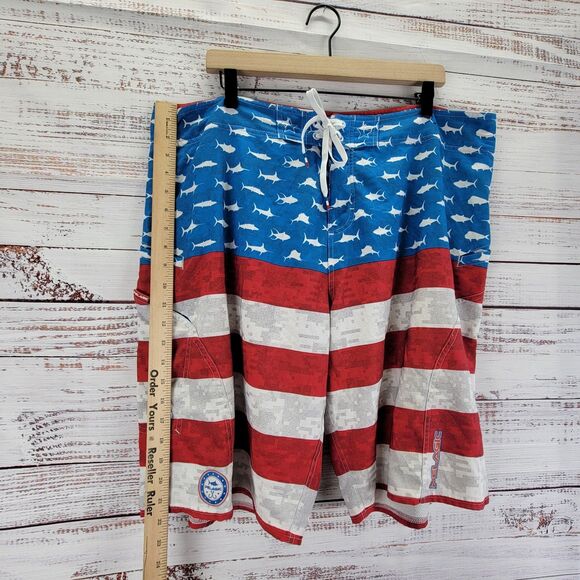 Pelagic Sharkskin Men’s 40 Red Blue American Camo Board Shorts Fish Print - Picture 2 of 15